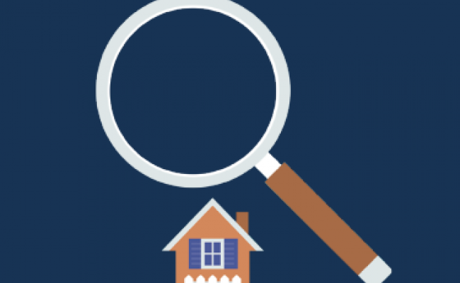 a large magnifying glass over a house
