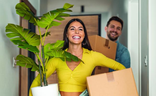 Male and female Gen Z Buyers moving in to their new home.